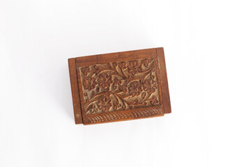 Wooden closed carved box handmade. Patterns of Indian culture in the form of New Age Source The Carved Wood Box Flower of Life. Isolated on a white background.