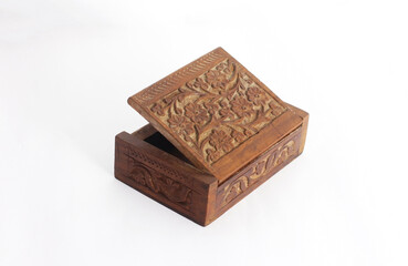 Wooden open carved box handmade. Patterns of Indian culture in the form of New Age Source The Carved Wood Box Flower of Life. Isolated on a white background.