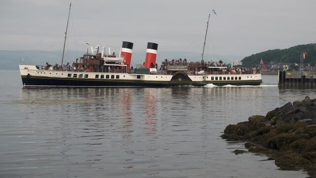 The PS Waverley a paddle steamer sailing in the waters from Largs in Scotland, UK.  She was built in 1946 and powered by a triple expansion steam engine.