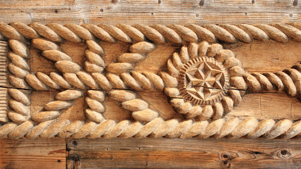 Wood carving detail on gate in Maramures, Romania