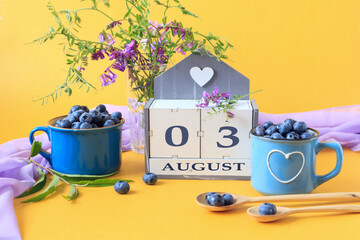 Calendar for August 3 :the name of the month of August in English, cubes with the numbers 0 and 3,...