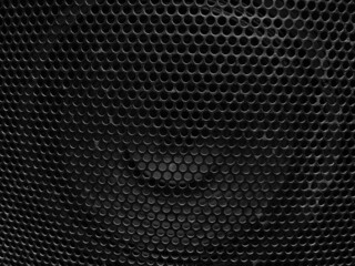 Black metal speaker mesh background, Metallic texture or pattern with small holes, monochrome image