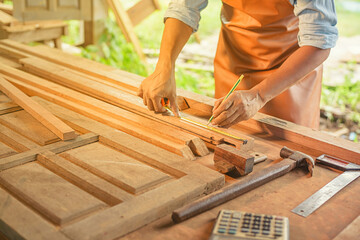 Carpenter Woodwork and furniture making in carpentry workshop