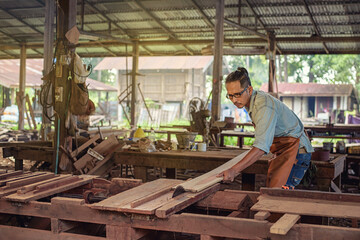 Naklejka na ściany i meble Carpenter Woodwork and furniture making in carpentry workshop