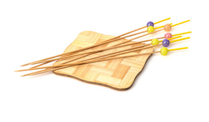 Bamboo wooden skewers on blackboard isolated on white