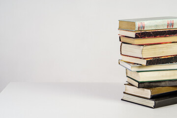 Stack of old books on white background