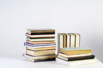 Stack of old books on white background