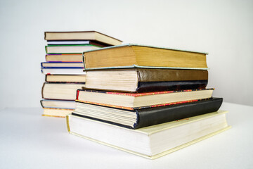 Stack of old books on white background