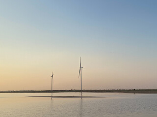 Modern electric mills and the sea.