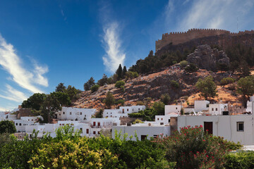 View of Acropolis of Lindos with Typical White Buildings in Rhodes. Natural Citadel on Hill in...