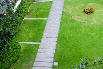 Outdoor pathway on green grass garden