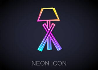 Glowing neon line Floor lamp icon isolated on black background. Vector