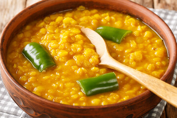 Ethiopian Split Pea stew  Kik Alicha Vegan Glutenfree closeup in the bowl on the table. Horizontal