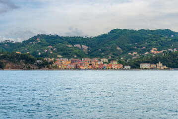 Fototapeta premium The small village of San Terenzo seen from the sea, Gulf of La Spezia, municipality of Lerici, Mediterranean sea, Liguria, Italy, Europe. 