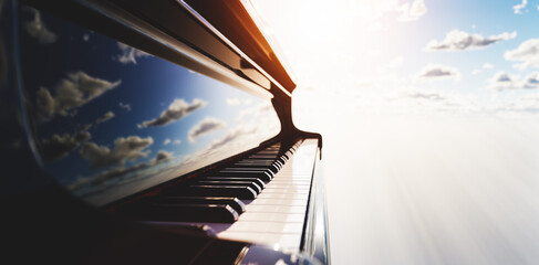 Grand piano keyboard on blue sky © Photocreo Bednarek