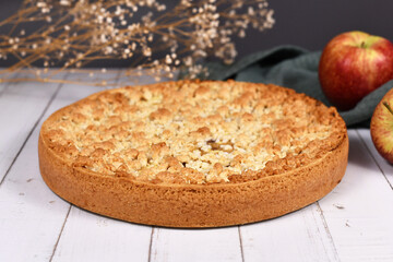 Whole traditional European apple pie with topping crumbles called 'Streusel'