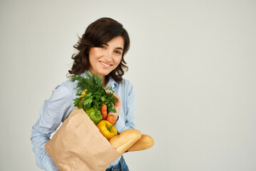 cheerful woman with a package of groceries supermarket shopping lifestyle