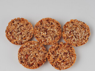 Top view close photo image on a muesli pile, abstract grain painting, granule texture as background, overlay for artwork