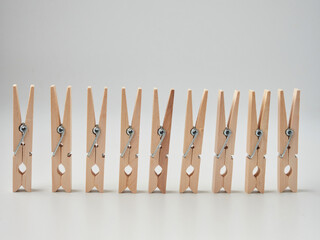 Set of wooden clothes pins on white background