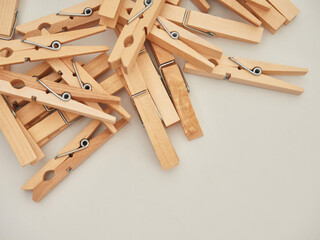 Set of wooden clothes pins on white background