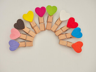 Set of wooden clothes pins on white background