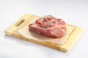 Raw pork neck over board