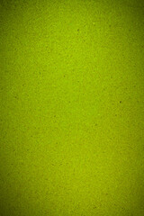 Texture recycled compressed green wood chippings board background.
