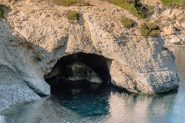 nature arch S'Archittu on Sardinia island with blue turquoise water