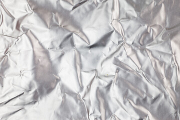Crumpled aluminum foil background.