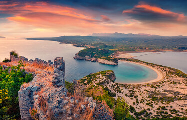 Azure summer view of Voidokilia Beach from Old Navarino Castle. Aerial sunset on Ionian sea. Wonderful evening scene of Peloponnese peninsula, Greece, Europe. Beauty of nature concept background.