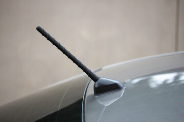Short radio antenna on the roof of a new budget vehicle