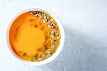 Pumpkin soup. Vegan butternut squash cream soup, shot from above with copy space. Healthy dinner