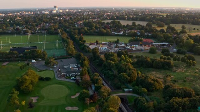 Overhead drone shot of London Underground Piccadilly Line train outskirts of the city