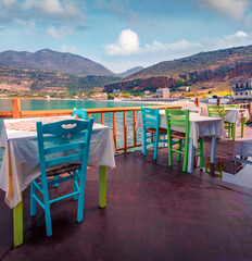 Spectacular summer cityscape of Neo Itilo village. Hospitable cafe on the shore of Ionian sea. Marvelous morning scene of Peloponnese peninsula, Greece, Europe. Traveling concept background..