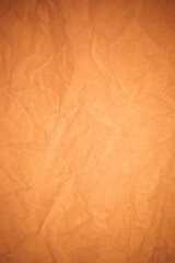 Crumpled brown paper background.