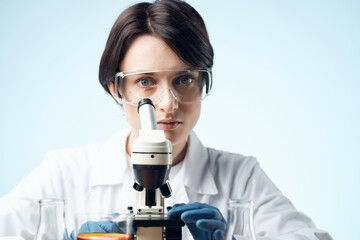 woman scientist with a microscope in the hands of technology research