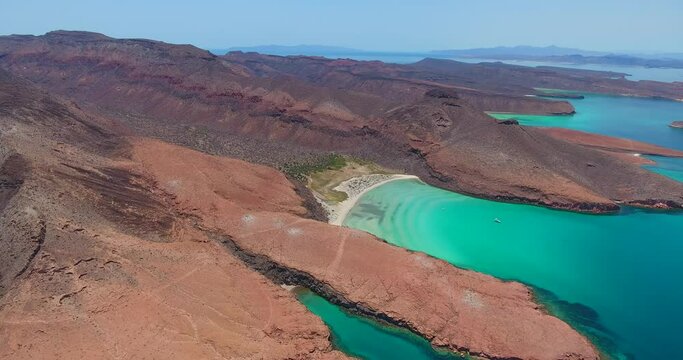 Strafe Aerial of Powerboats in a Private Beach Cove with Scenic Mountains and Islands Background