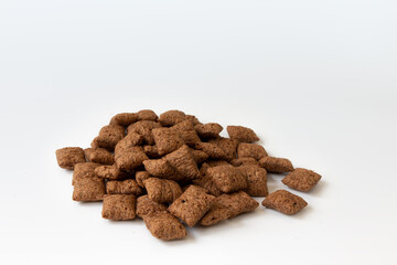 chocolate corn pads isolated on white background, cereals breakfast