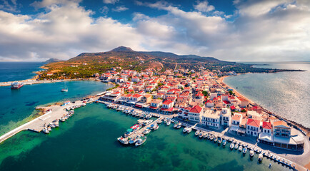 Coilorful summer cityscape of Elafonisos town. View from flying drone of Elafonisos island, Greece, Europe. Stunning Mediterranean seascape. Traveling concept background..