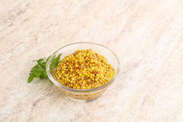 Grain mustard sauce in the bowl