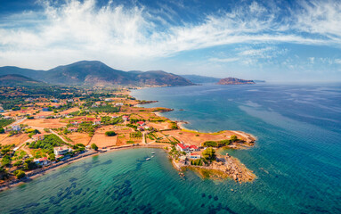 Aerial summer view of Xifias village vith Monemvasia mountain on background. Beautiful summer scene of Peloponnese peninsula, Greece, Europe. Bright Myrtoan Sea.