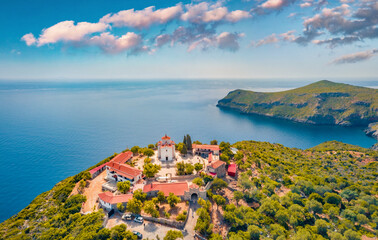 View from flying drone of Moni Evaggelistrias church. Fresh green scene of Peloponnese peninsula,...