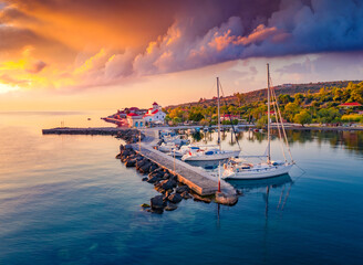 Colorful summer sunrise in St. Georgios port. Amazing morning scene of Peloponnese peninsula,...