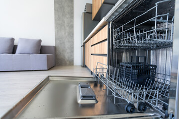 dishwasher with opened door in a kitchen