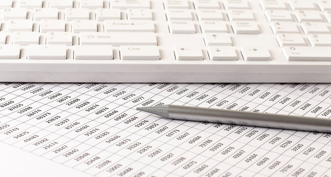 business accounter work with taxes and keyboard on white office desk top view