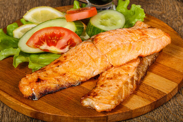 Grilled salmon served vegetables and lemon