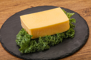 Tasty yelloow Tilsiter cheese brick
