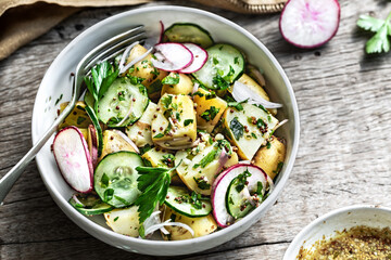 Potato with Cucumber Radish Salad in a bowl