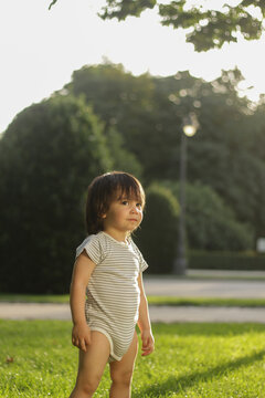 Little 1 Year Old Hispanic Boy In The Park At Sunset