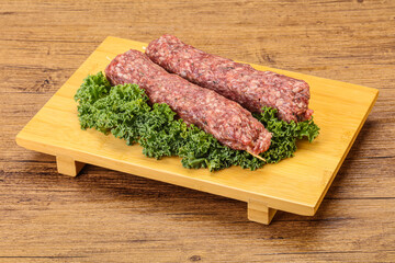 Raw minced beef kebab skewer
